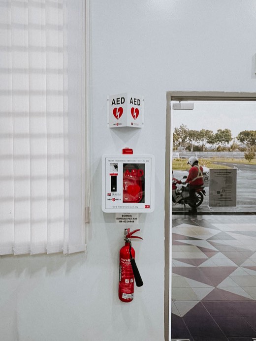 MYHeart AED in a wall cabinet with AED signage, installed on site
