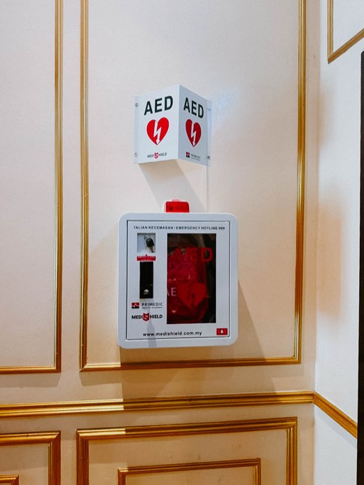 MYHeart AED in a wall cabinet with AED signage, installed on site