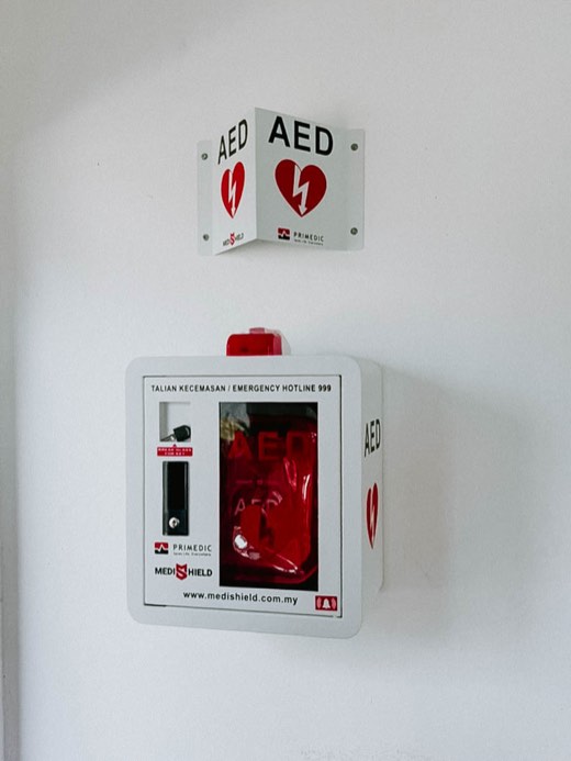 MYHeart AED in a wall cabinet with AED signage, installed on site