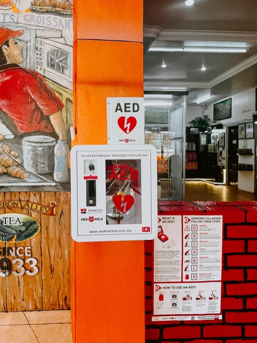 MYHeart AED in a wall cabinet with AED signage, installed on site