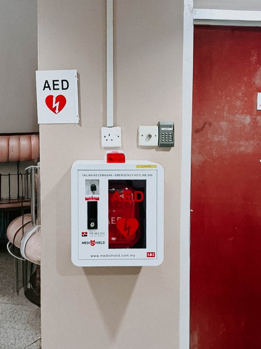 MYHeart AED in a wall cabinet with AED signage, installed on site