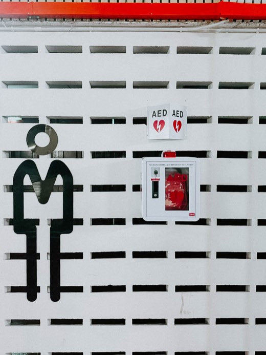 MYHeart AED in a wall cabinet with AED signage, installed on site