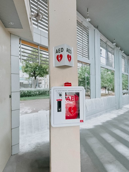 MYHeart AED in a wall cabinet with AED signage, installed on site