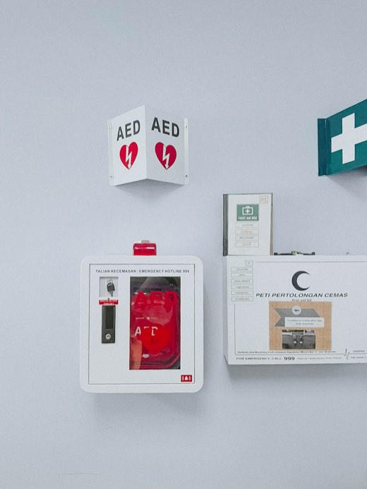 MYHeart AED in a wall cabinet with AED signage, installed on site