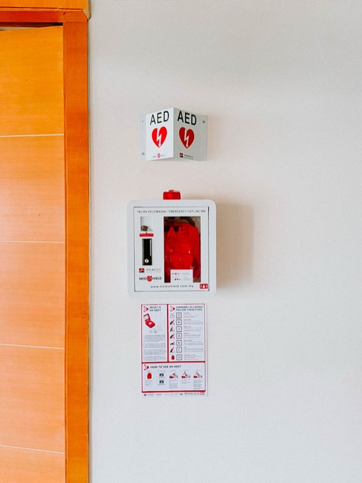 MYHeart AED in a wall cabinet with AED signage, installed on site