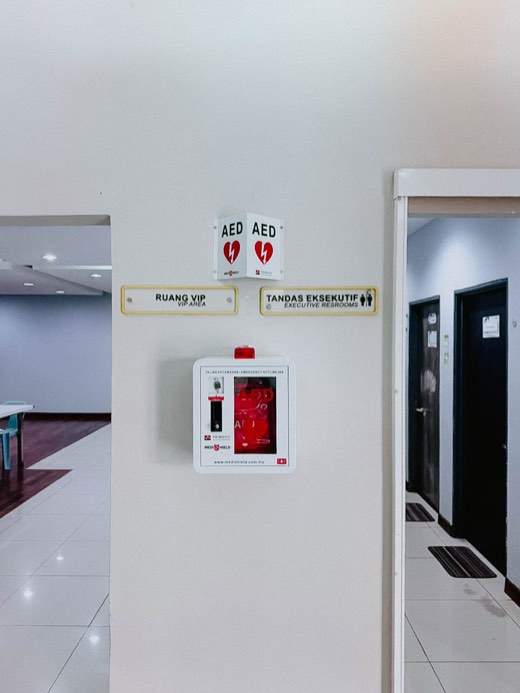 MYHeart AED in a wall cabinet with AED signage, installed on site
